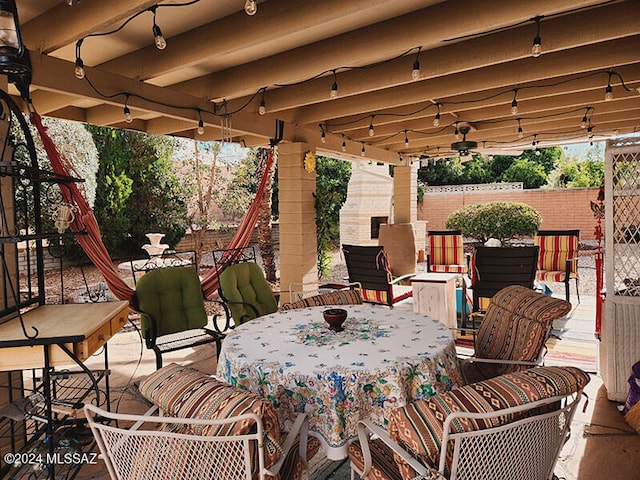 view of patio featuring ceiling fan