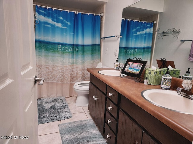 bathroom featuring tile patterned flooring, vanity, toilet, and curtained shower