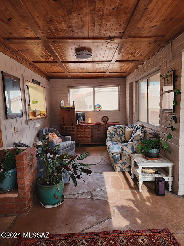 sunroom featuring wood ceiling