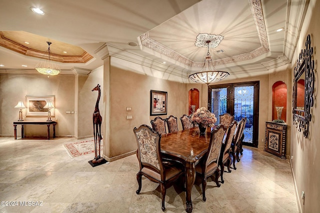 dining room featuring crown molding and a tray ceiling