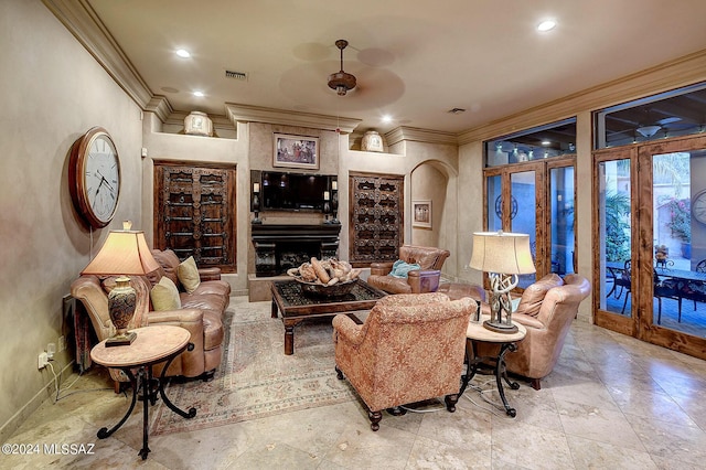 living room featuring crown molding and french doors