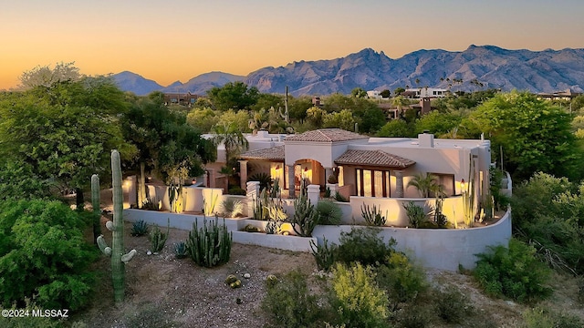 view of front of home with a mountain view