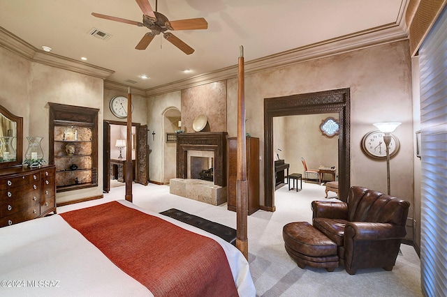 carpeted bedroom featuring ornamental molding and a high end fireplace