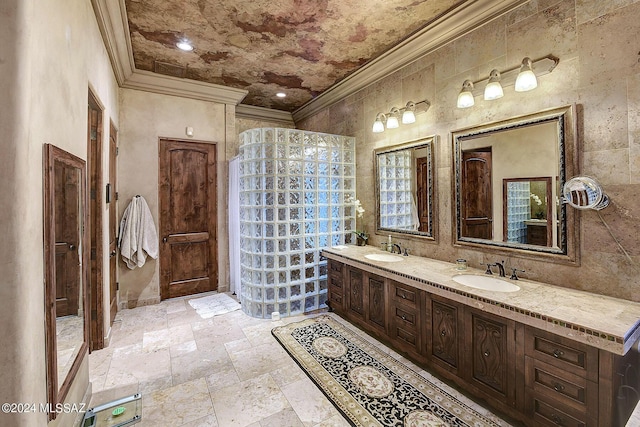 bathroom with crown molding and vanity