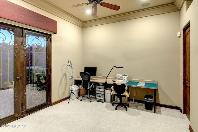 carpeted home office featuring crown molding and ceiling fan