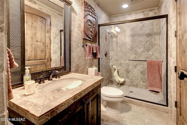 bathroom with vanity, toilet, and walk in shower