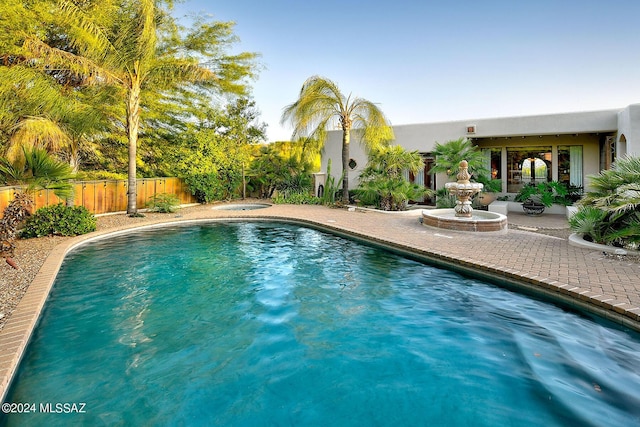 view of pool featuring a patio