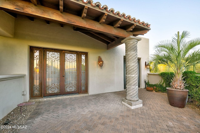 property entrance featuring french doors