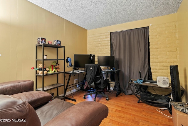 office space featuring a textured ceiling and hardwood / wood-style flooring