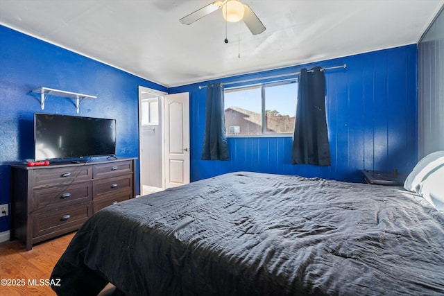 bedroom featuring hardwood / wood-style flooring and ceiling fan