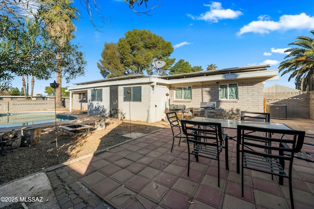 back of house with a patio