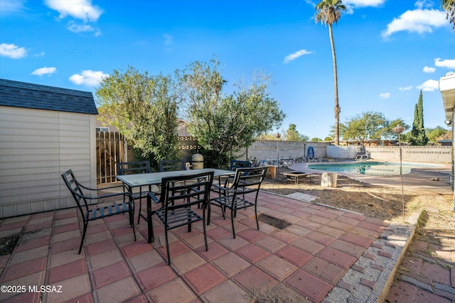 view of patio with a fenced in pool