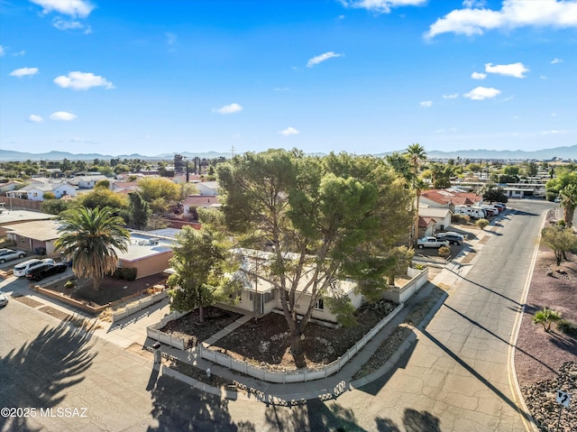 birds eye view of property with a mountain view