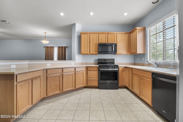 kitchen with visible vents, range with gas cooktop, black microwave, dishwashing machine, and a peninsula