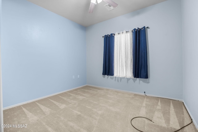 unfurnished room with light carpet and ceiling fan