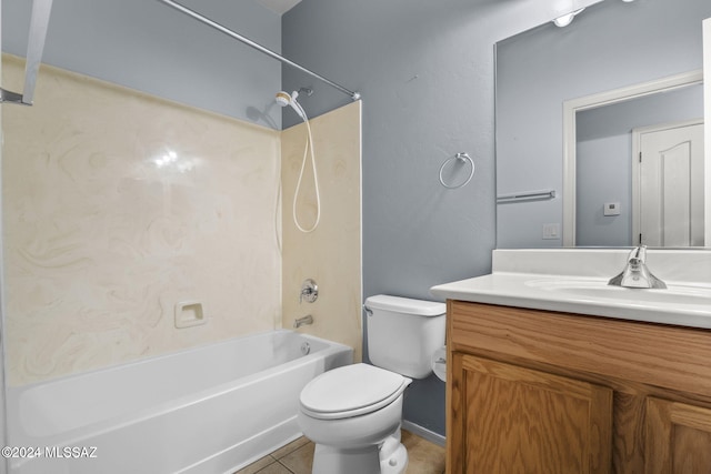 bathroom featuring toilet, vanity, tile patterned flooring, and washtub / shower combination