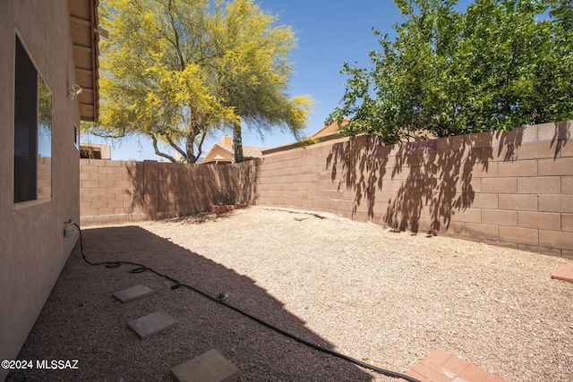 view of yard featuring a patio and a fenced backyard