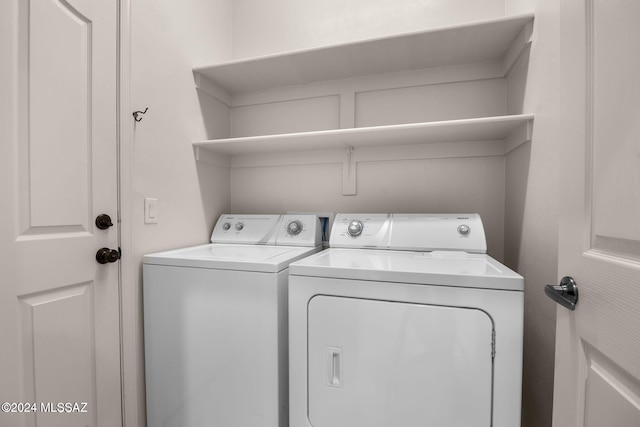 laundry room with independent washer and dryer