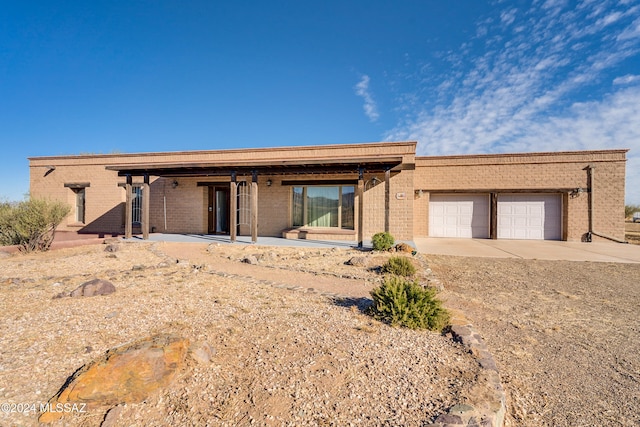 single story home featuring a garage