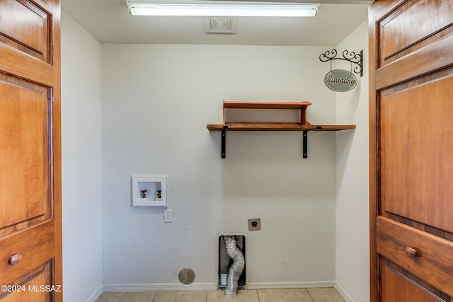 laundry area featuring light tile patterned floors, washer hookup, and hookup for an electric dryer