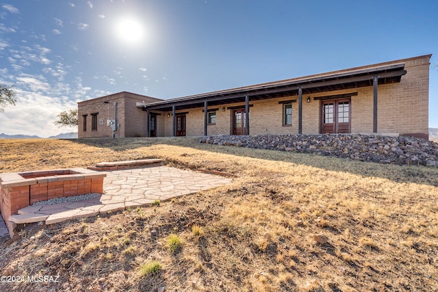 back of property featuring a patio area