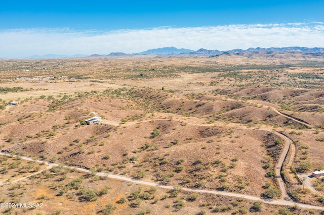 birds eye view of property with a mountain view