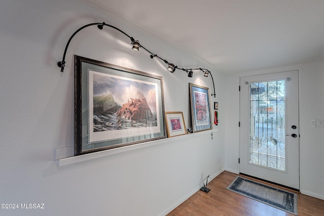 doorway to outside featuring hardwood / wood-style flooring