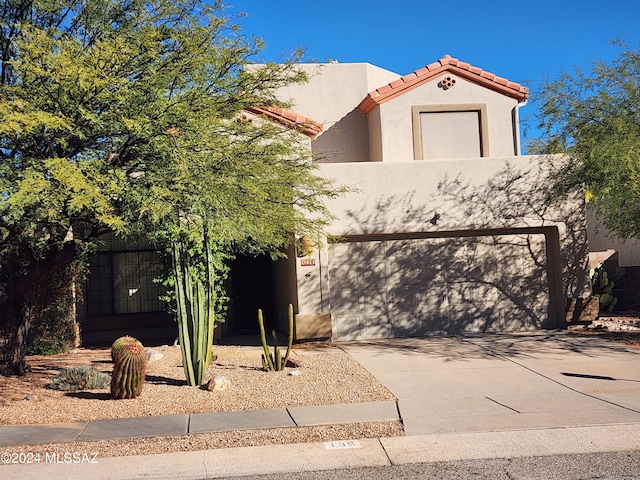 view of front of property with a garage