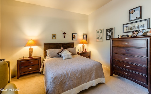 bedroom featuring light colored carpet