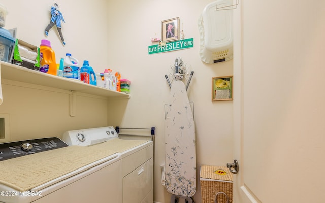 clothes washing area with laundry area and washing machine and clothes dryer