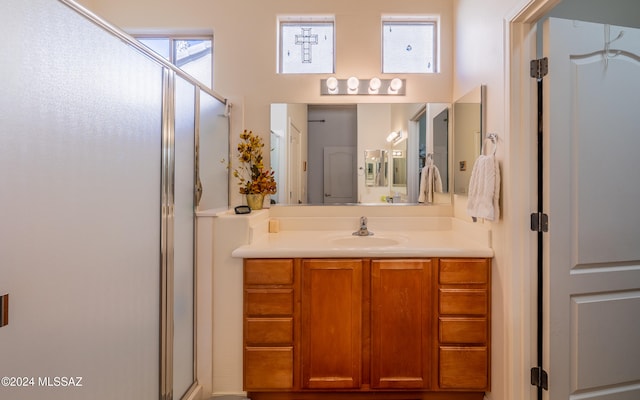 full bathroom featuring a shower stall and vanity