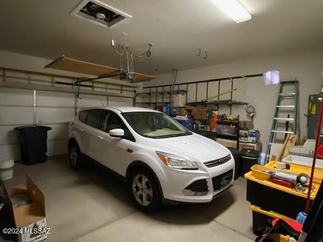 garage featuring a garage door opener