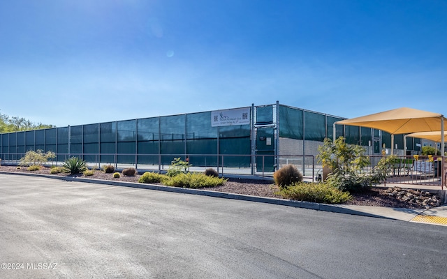 view of building exterior featuring fence