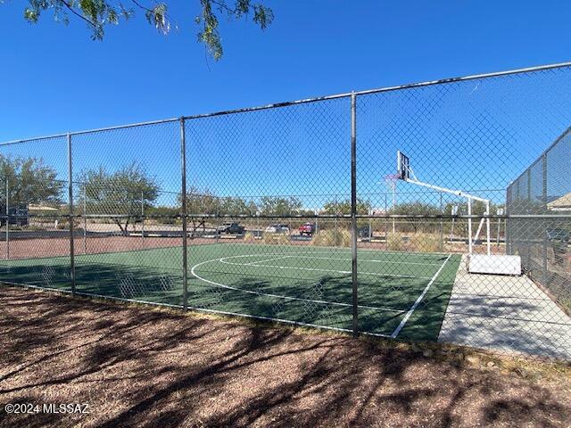 view of sport court featuring community basketball court and fence