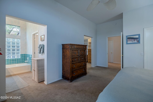 carpeted bedroom featuring multiple windows and ceiling fan