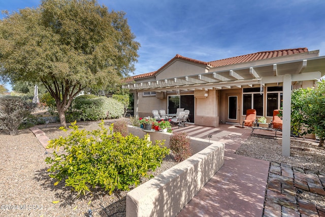 rear view of house with a patio area