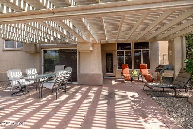 view of patio / terrace featuring a pergola and a grill