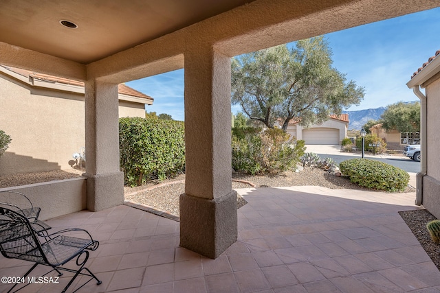 view of patio / terrace with a mountain view