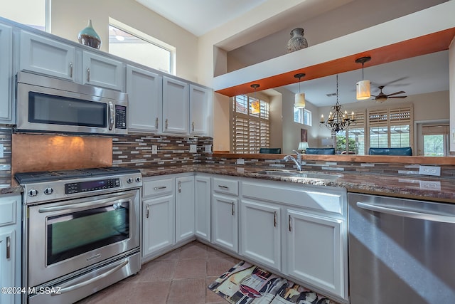 kitchen featuring a wealth of natural light, sink, and appliances with stainless steel finishes