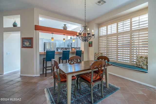 dining area featuring an inviting chandelier