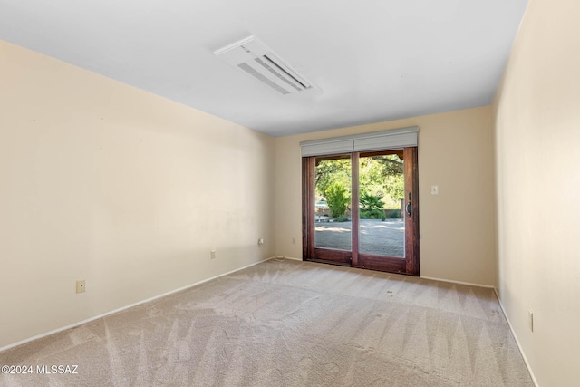 unfurnished room with light colored carpet