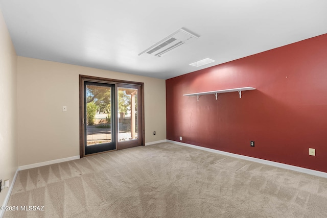 empty room with light colored carpet