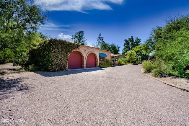 mediterranean / spanish-style house featuring a garage