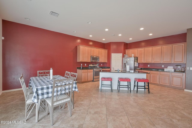 dining space featuring recessed lighting, light tile patterned flooring, and baseboards