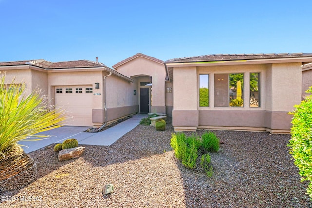 view of front of property with a garage