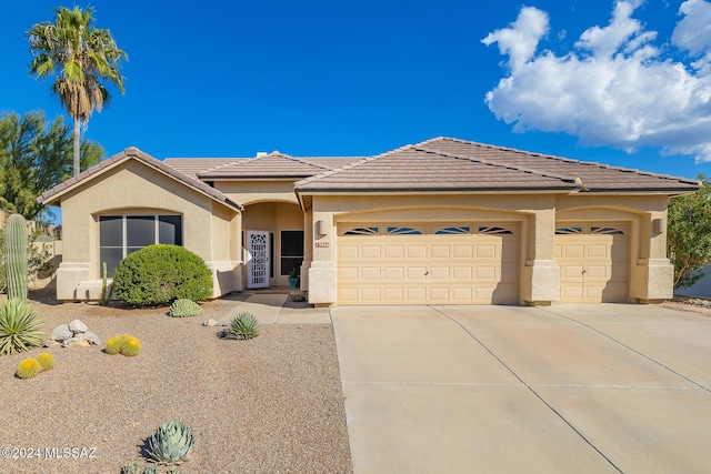 view of front of property with a garage