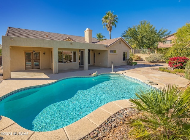 view of swimming pool with a patio