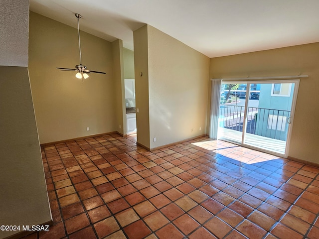 unfurnished room featuring tile patterned floors, ceiling fan, and vaulted ceiling