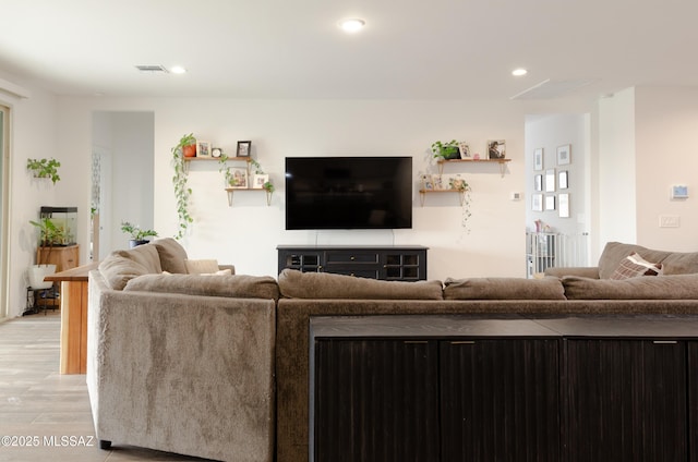 living room with light hardwood / wood-style floors