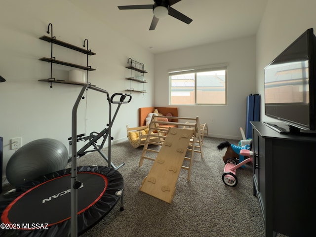 playroom featuring a ceiling fan, baseboards, and carpet floors